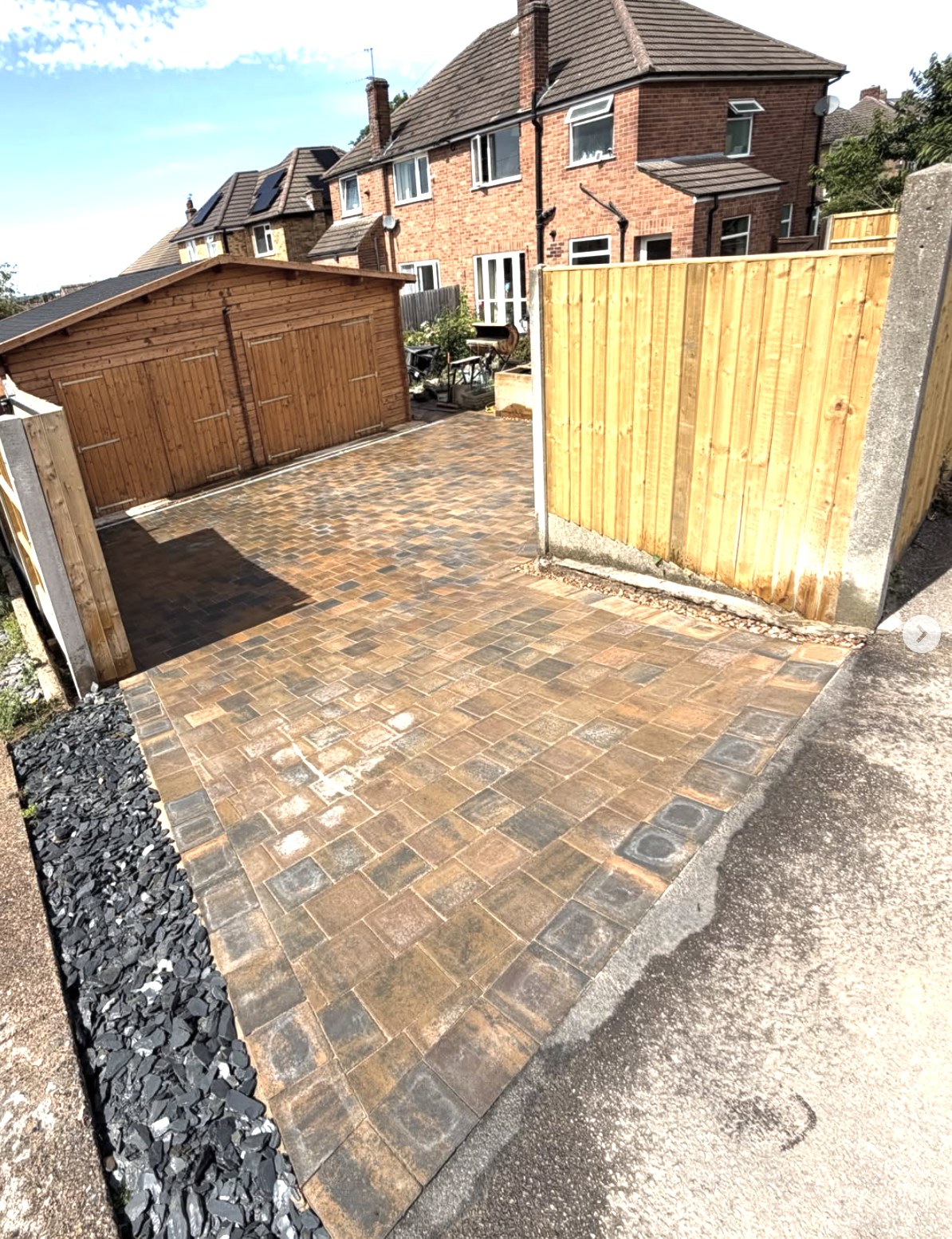 New garden fencing beside paving